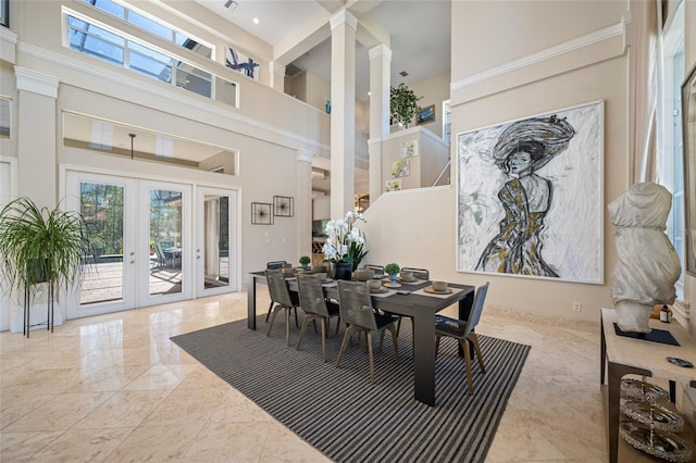 19005 Cour Ests, Lutz, FL 33558 - dining space featuring a high ceiling, french doors, marble tiled flooring, and ornate columns