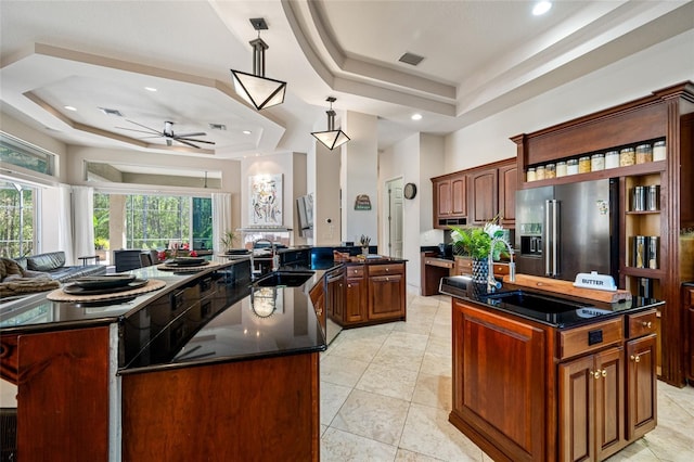 19005 Cour Ests, Lutz, FL 33558 - kitchen with a raised ceiling, high end fridge, a large island, a sink, and dishwasher