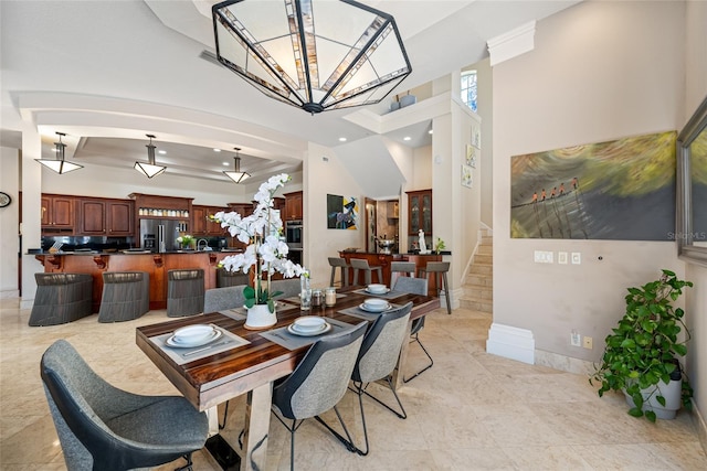 19005 Cour Ests, Lutz, FL 33558 - dining space with a chandelier, stairs, baseboards, and light tile patterned floors
