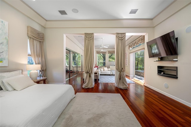 19005 Cour Ests, Lutz, FL 33558 - bedroom with access to outside, wood finished floors, baseboards, and ornamental molding