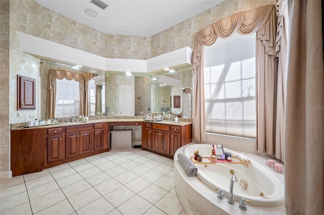 19005 Cour Ests, Lutz, FL 33558 - full bathroom with a jetted tub, a shower stall, wallpapered walls, tile patterned floors, and vanity