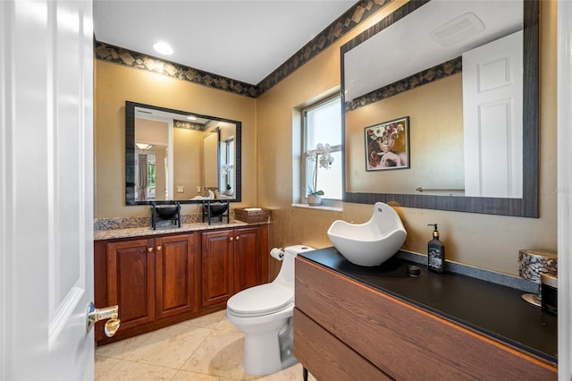 19005 Cour Ests, Lutz, FL 33558 - bathroom featuring vanity, tile patterned floors, and toilet