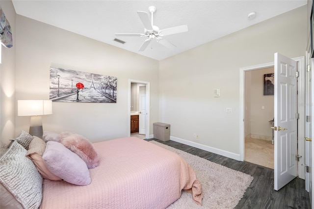 19005 Cour Ests, Lutz, FL 33558 - bedroom featuring dark wood-style flooring, baseboards, ceiling fan, and connected bathroom