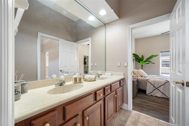 19005 Cour Ests, Lutz, FL 33558 - full bathroom featuring tile patterned flooring, double vanity, and ensuite bath