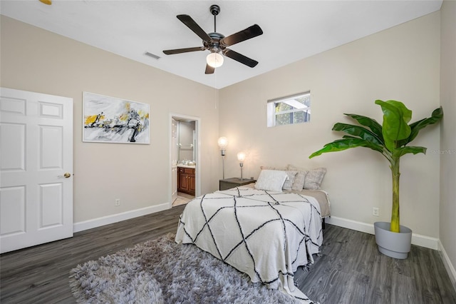 19005 Cour Ests, Lutz, FL 33558 - bedroom with wood finished floors, baseboards, ensuite bath, and a ceiling fan