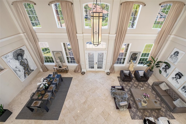 19005 Cour Ests, Lutz, FL 33558 - living area featuring a high ceiling, french doors, and healthy amount of natural light