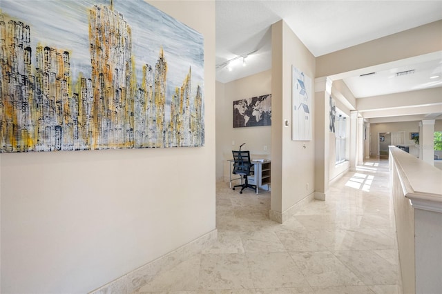 19005 Cour Ests, Lutz, FL 33558 - corridor featuring a desk and baseboards