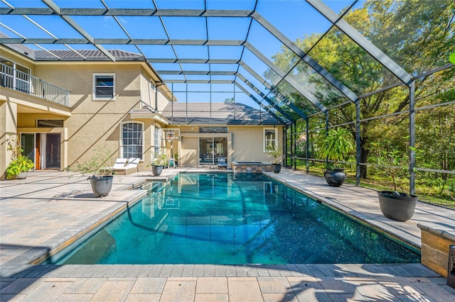 19005 Cour Ests, Lutz, FL 33558 - view of pool with a patio, glass enclosure, and a pool with connected hot tub