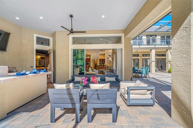 19005 Cour Ests, Lutz, FL 33558 - view of patio / terrace featuring an outdoor living space and a ceiling fan