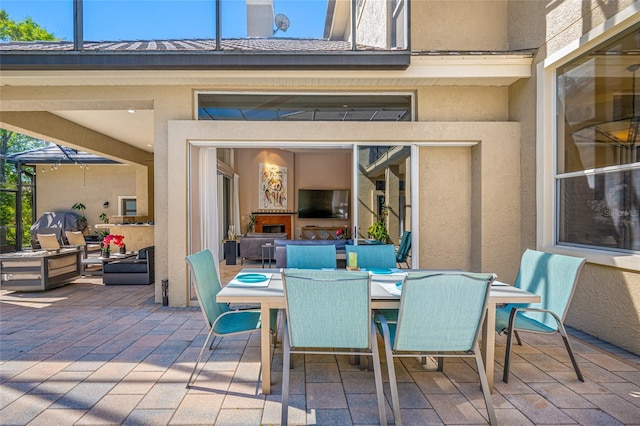 19005 Cour Ests, Lutz, FL 33558 - view of patio with outdoor dining area and an outdoor fireplace