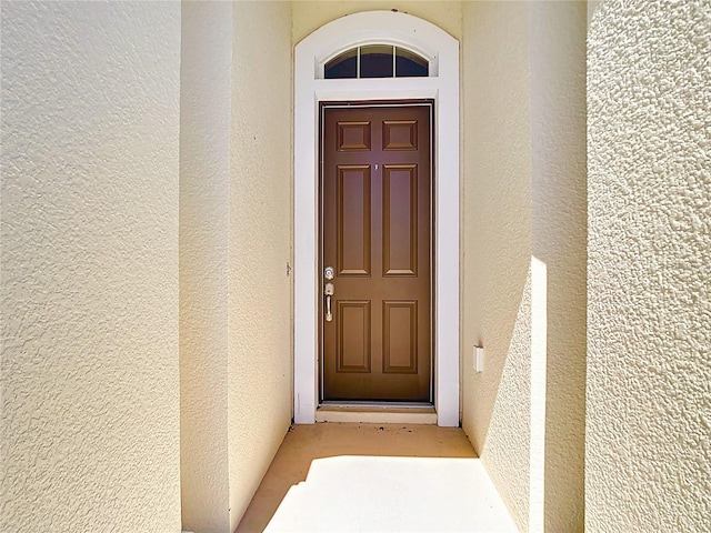 5235 SE 91st St, Ocala, FL 34480 - doorway to property featuring stucco siding
