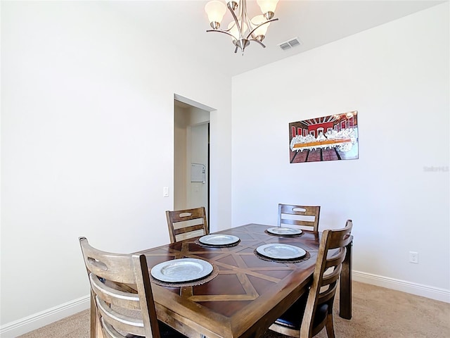 5235 SE 91st St, Ocala, FL 34480 - dining area with light colored carpet, baseboards, a notable chandelier, and visible vents