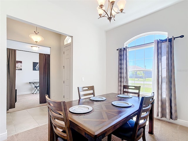 5235 SE 91st St, Ocala, FL 34480 - dining space featuring baseboards, light carpet, a chandelier, and light tile patterned flooring