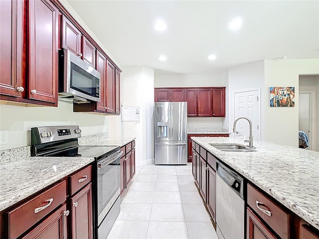 5235 SE 91st St, Ocala, FL 34480 - kitchen featuring a sink, recessed lighting, appliances with stainless steel finishes, light tile patterned flooring, and dark brown cabinets