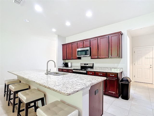 5235 SE 91st St, Ocala, FL 34480 - kitchen featuring visible vents, recessed lighting, a sink, appliances with stainless steel finishes, and reddish brown cabinets