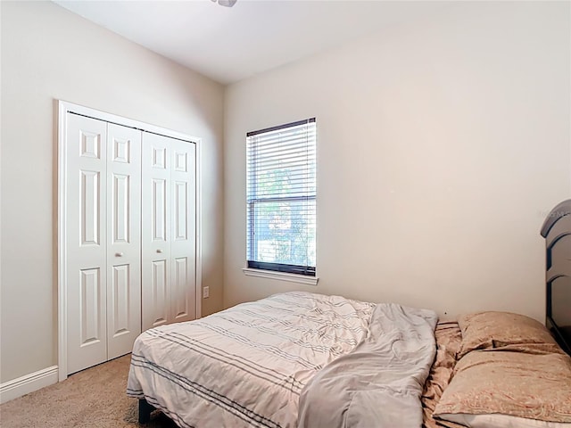 5235 SE 91st St, Ocala, FL 34480 - bedroom with light colored carpet, a closet, and baseboards