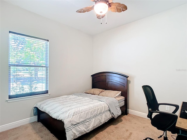 5235 SE 91st St, Ocala, FL 34480 - bedroom with ceiling fan, baseboards, and light carpet