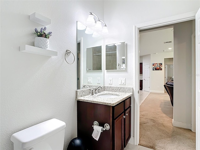 5235 SE 91st St, Ocala, FL 34480 - bathroom featuring vanity, toilet, baseboards, and visible vents