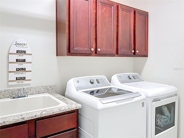 5235 SE 91st St, Ocala, FL 34480 - laundry area featuring cabinet space, independent washer and dryer, and a sink