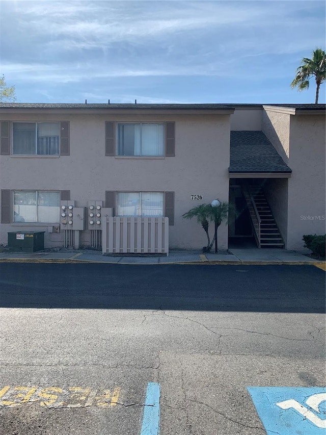 7526 Needle Leaf Pl Unit 30, Tampa, FL 33617 - view of building exterior with central AC unit and stairs