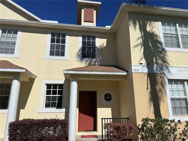 doorway to property with stucco siding