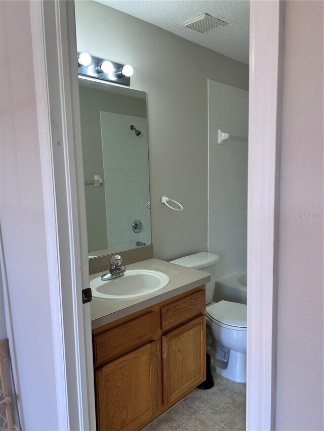 2061 Fiesta Ridge Ct, Tampa, FL 33604 - full bath with a textured ceiling, vanity, shower / tub combination, toilet, and visible vents