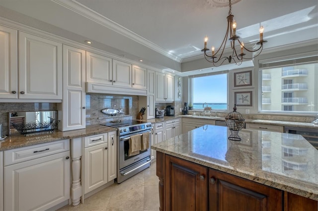 kitchen with white cabinets, a notable chandelier, a sink, electric stove, and decorative backsplash