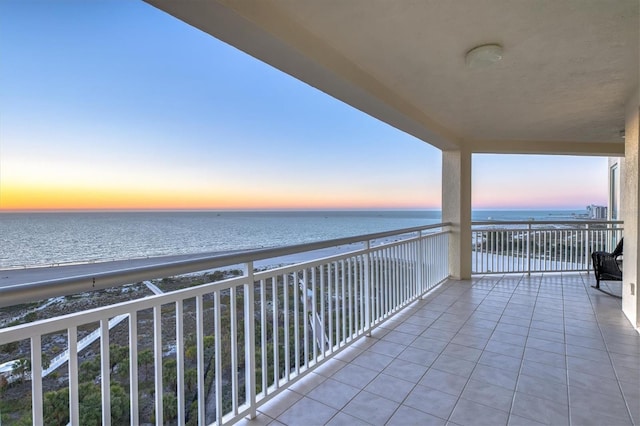 balcony featuring a water view