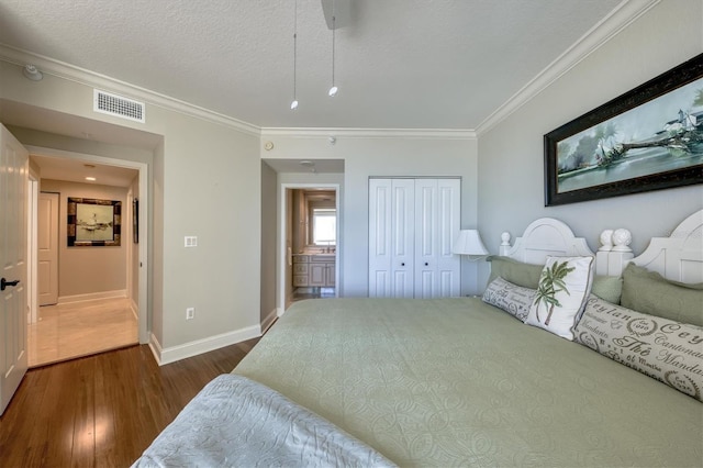 bedroom featuring ornamental molding, visible vents, baseboards, and dark wood-style flooring
