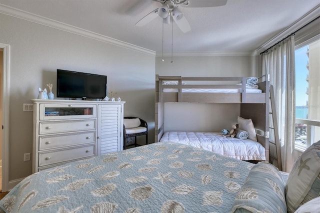 bedroom featuring ornamental molding and ceiling fan