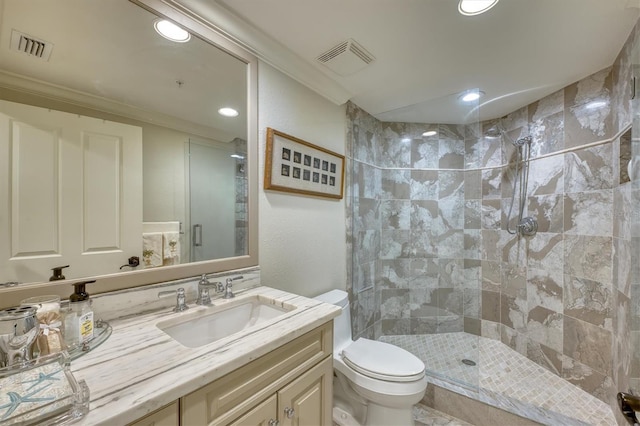 bathroom with a shower stall, vanity, visible vents, recessed lighting, and toilet