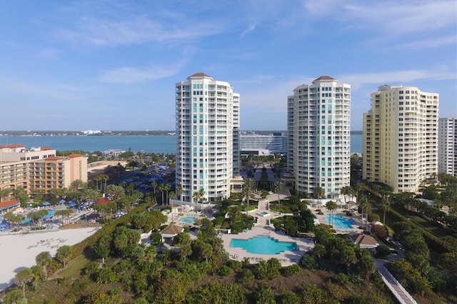drone / aerial view featuring a water view and a city view