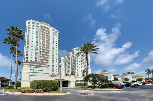 view of building exterior with uncovered parking