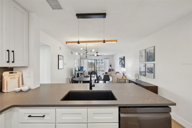 6277 Bahia Del Mar Blvd Unit 210, Saint Petersburg, FL 33715 - kitchen with dishwasher, a sink, and white cabinets