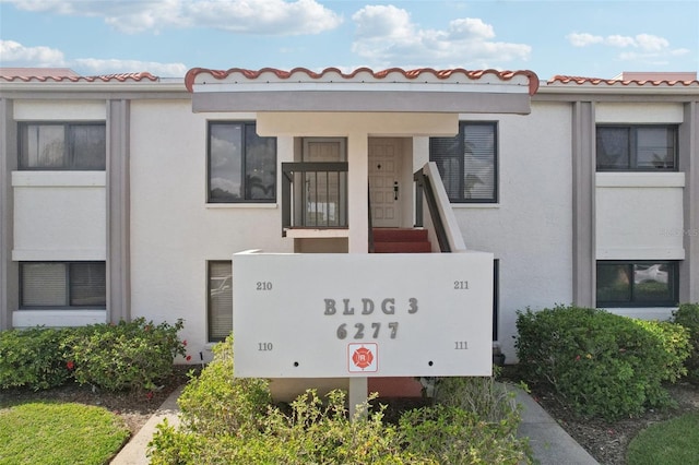 6277 Bahia Del Mar Blvd Unit 210, Saint Petersburg, FL 33715 - view of front facade featuring stucco siding and a tiled roof