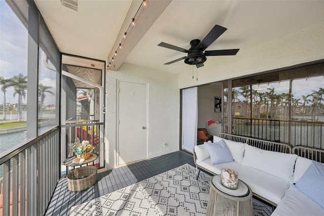 6277 Bahia Del Mar Blvd Unit 210, Saint Petersburg, FL 33715 - sunroom / solarium featuring ceiling fan, outdoor lounge area, a water view, and rail lighting