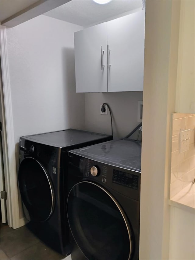 11233 51st Ave N, Saint Petersburg, FL 33708 - washroom with tile patterned flooring and independent washer and dryer