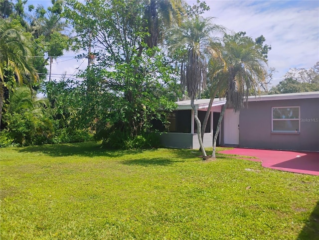 11233 51st Ave N, Saint Petersburg, FL 33708 - view of yard featuring a sunroom and a patio