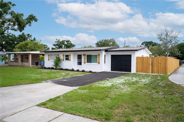 4601 71st Ave N, Pinellas Park, FL 33781 - ranch-style house with a garage, stucco siding, and driveway