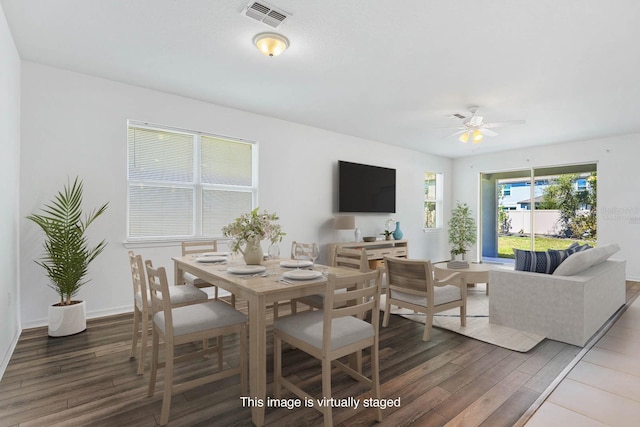 14180 Samoa Hill Ct, Riverview, FL 33569 - dining area featuring wood finished floors, a ceiling fan, and baseboards