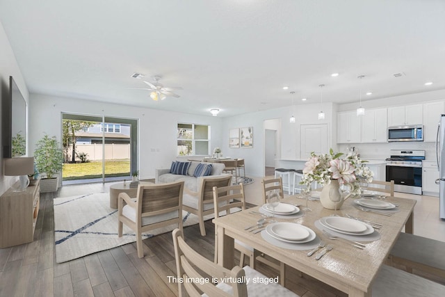 14180 Samoa Hill Ct, Riverview, FL 33569 - dining room with a ceiling fan, light wood-style floors, and recessed lighting