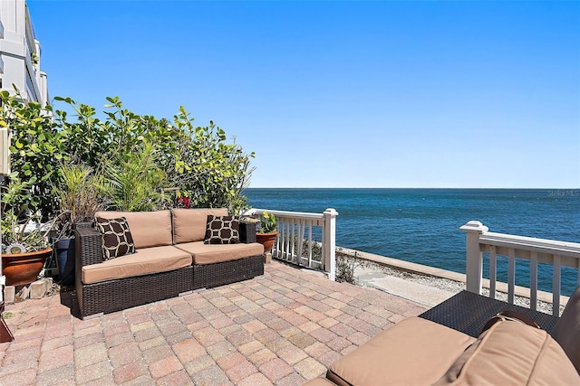 view of patio featuring a water view and an outdoor hangout area