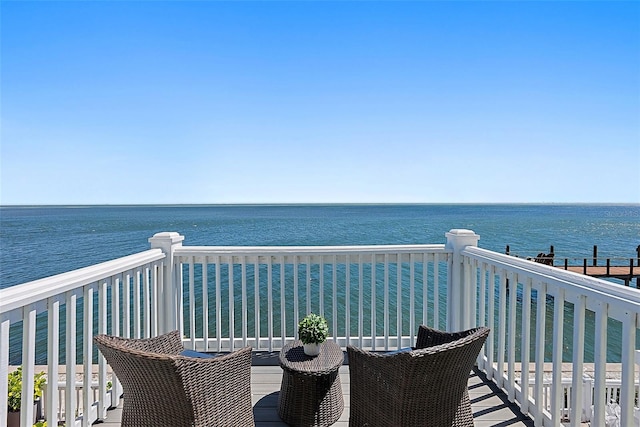 balcony featuring a water view