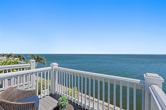 balcony featuring a water view