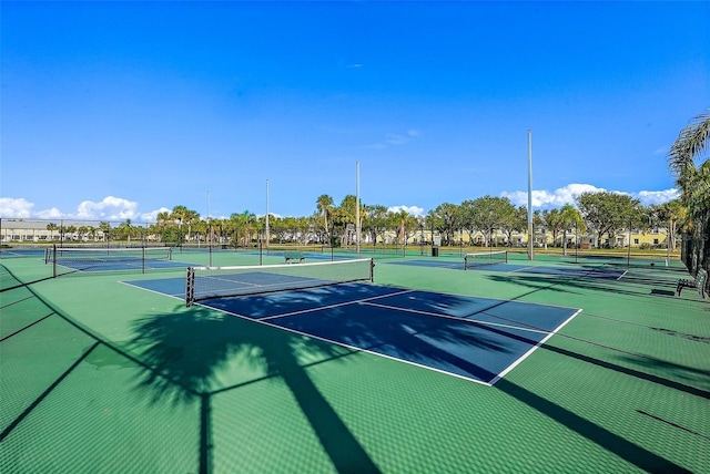 view of tennis court with fence