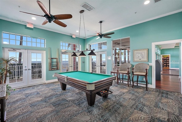 playroom with ornamental molding, french doors, visible vents, and ceiling fan