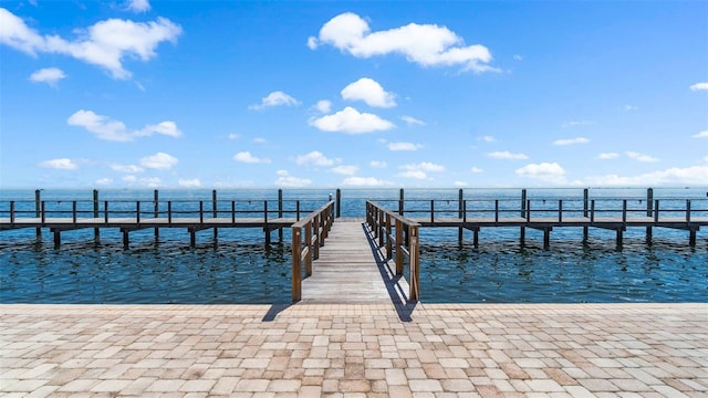 dock area with a pier and a water view