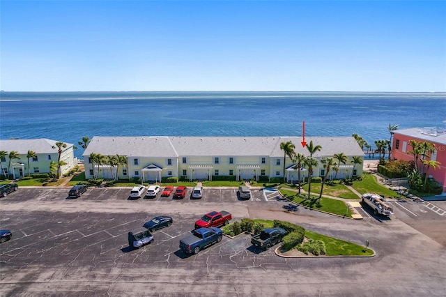 drone / aerial view with a residential view and a water view