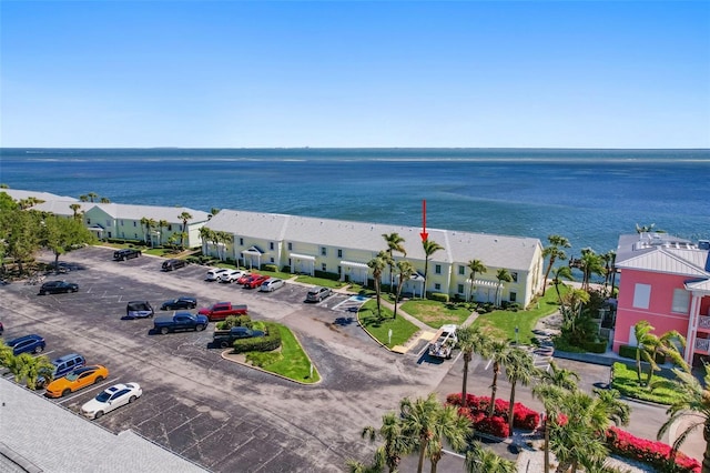 drone / aerial view with a residential view and a water view