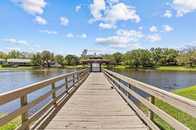 view of dock featuring a gazebo and a water view